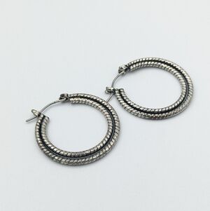 4/24$  Silver tone multi texture hoop earrings